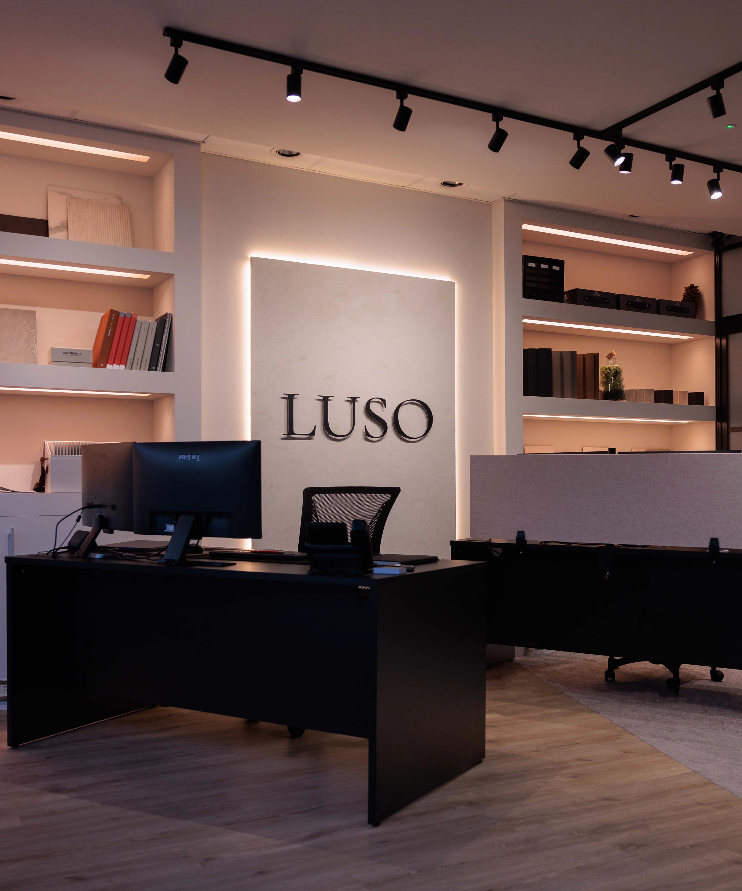 Inside the LUSO Architecture studio in Canford Cliffs, with material samples and the LUSO signage